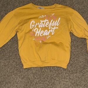Yellow crewneck saying “Grateful Heart”. In great condition